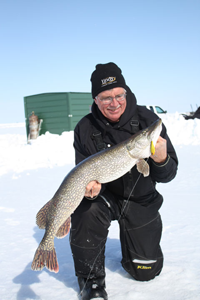 image of Nick Panovich holding Pike on Lake of the Woods